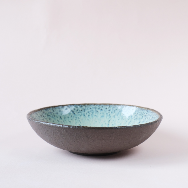 Small turquoise bowl made from dark chamotte